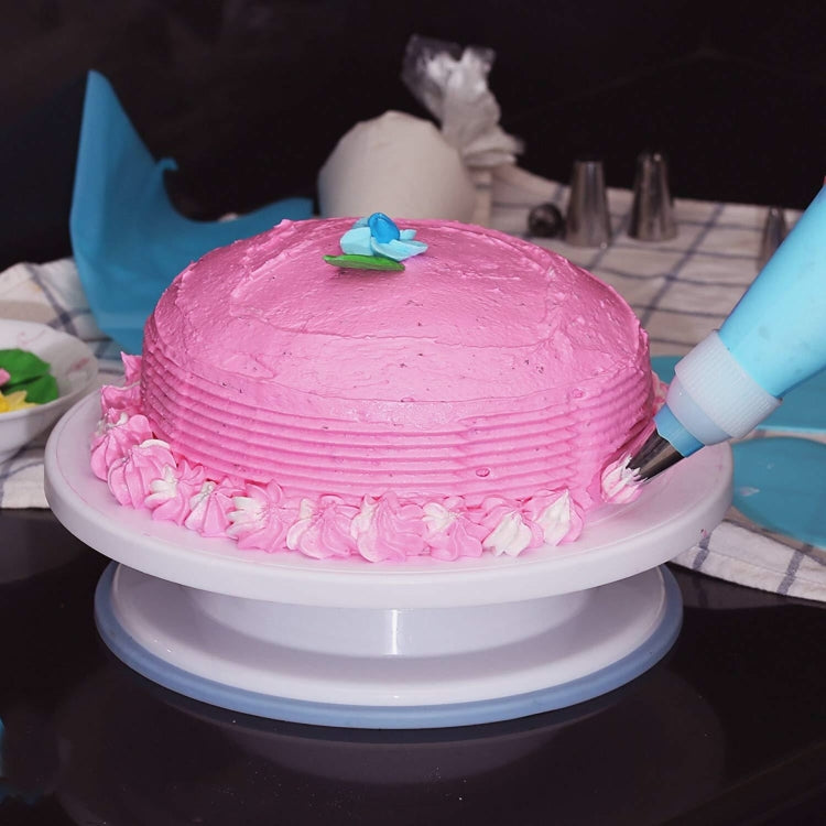 Cake turntable set with 106 stainless-steel decorating tips; blue accessories.