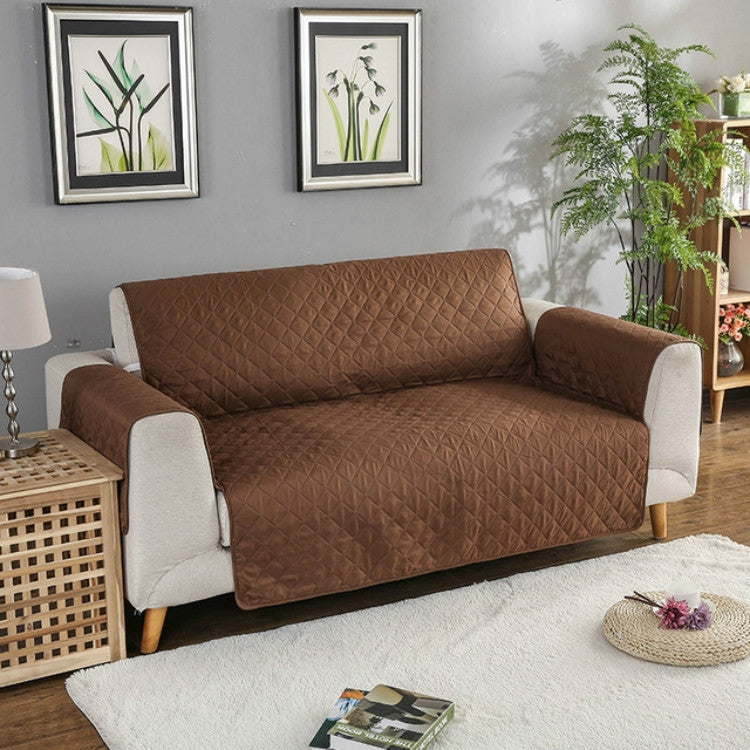 Brown quilted reversible sofa couch cover with armrest panels, protective slip-resistant fit