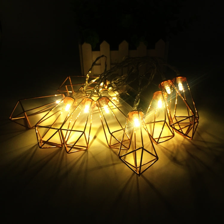 Illuminated copper metal diamond lantern LED string lights with warm glow