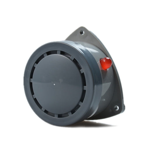 Water leak alarm detector angled view with circular grille and red button on gray body