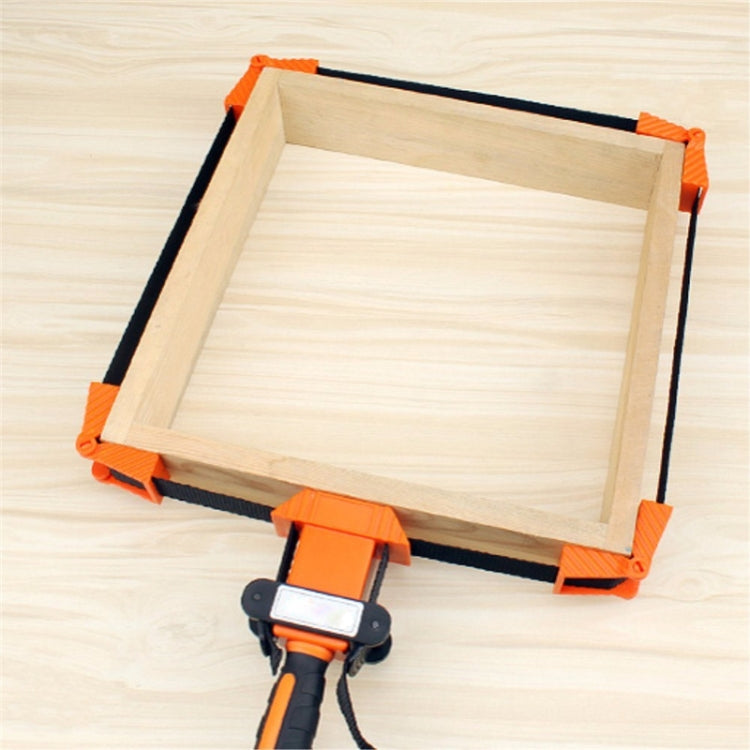 Wood board corner clamping frame with orange corner blocks and black tightening strap
