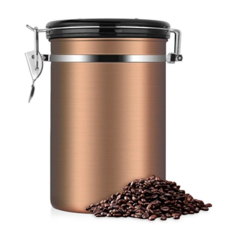 Bronze stainless steel coffee storage canister with black clamp lid and coffee beans