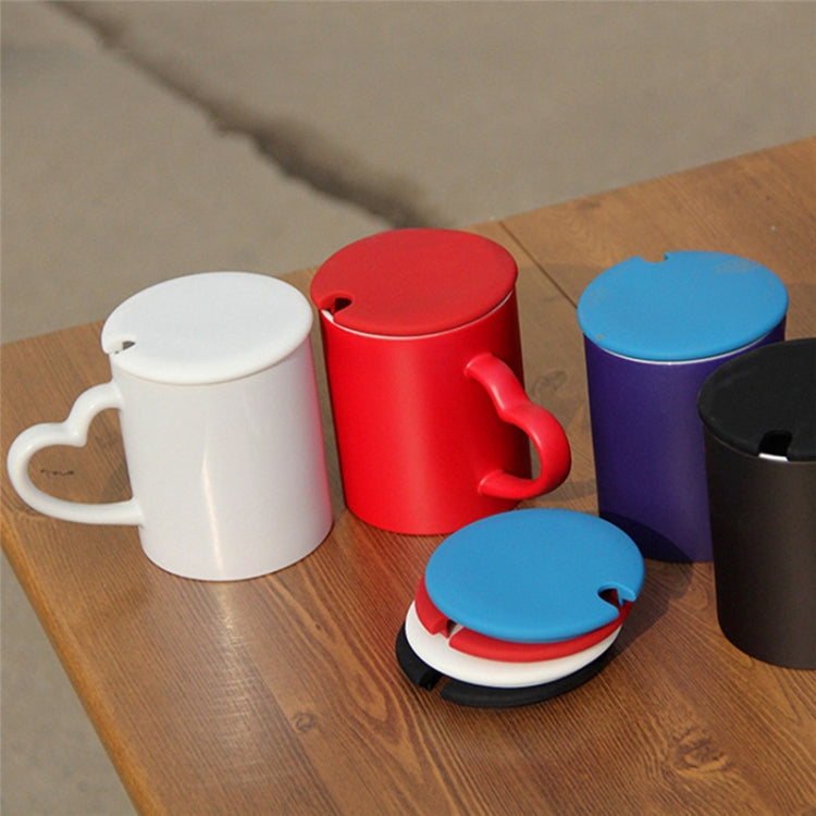 Assorted silicone cup lids in red, blue, white, black tones with vent gap