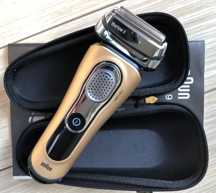 Black zippered shaver bag with Braun electric shaver inside
