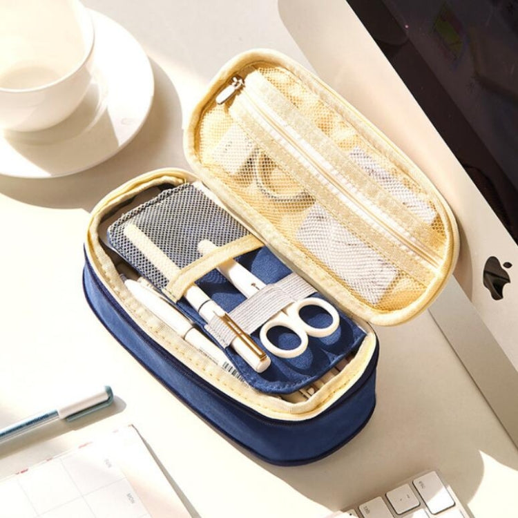 Navy zip mesh pencil case open with scissors and pens neatly stored