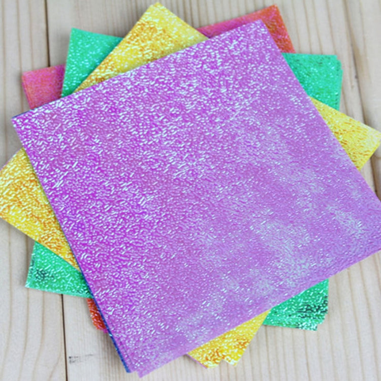 Square glitter folding paper sheets with a large purple sheet and teal accents