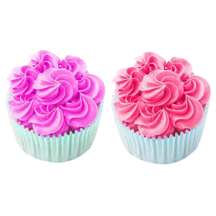 Cupcakes with pink rosette icing swirls and ridged liners, decorated with piping tip