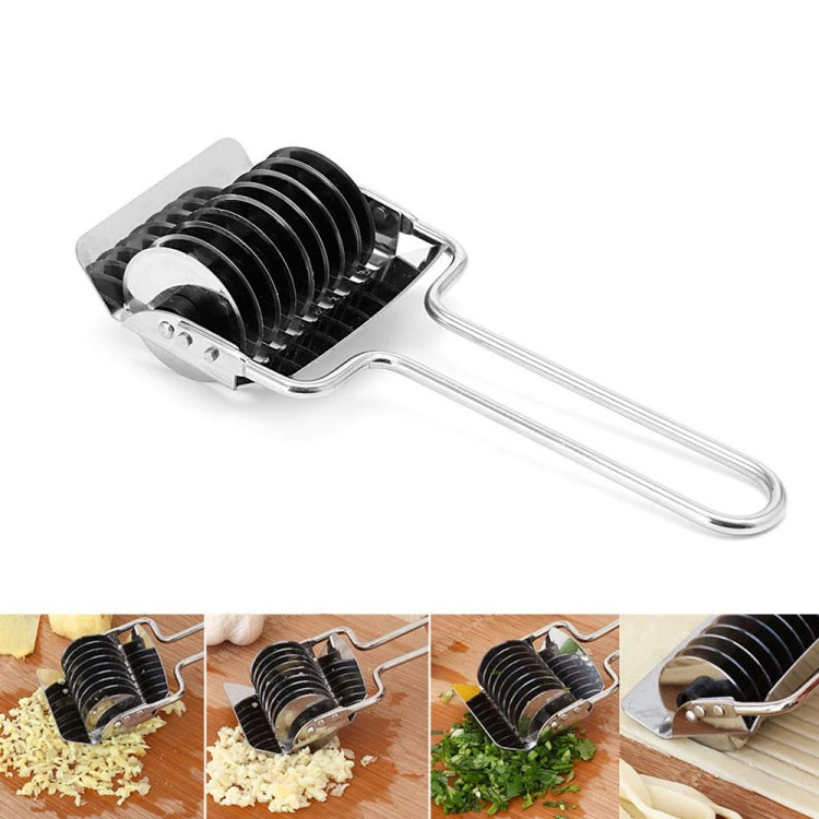 Manual noodle cutter with handle showing ridged rollers on pasta dough