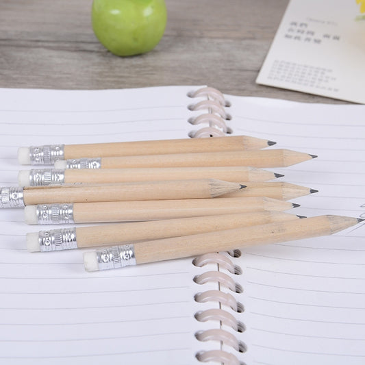 Wooden HB pencils on lined notebook, silver ferrules and sharpened points with white erasers