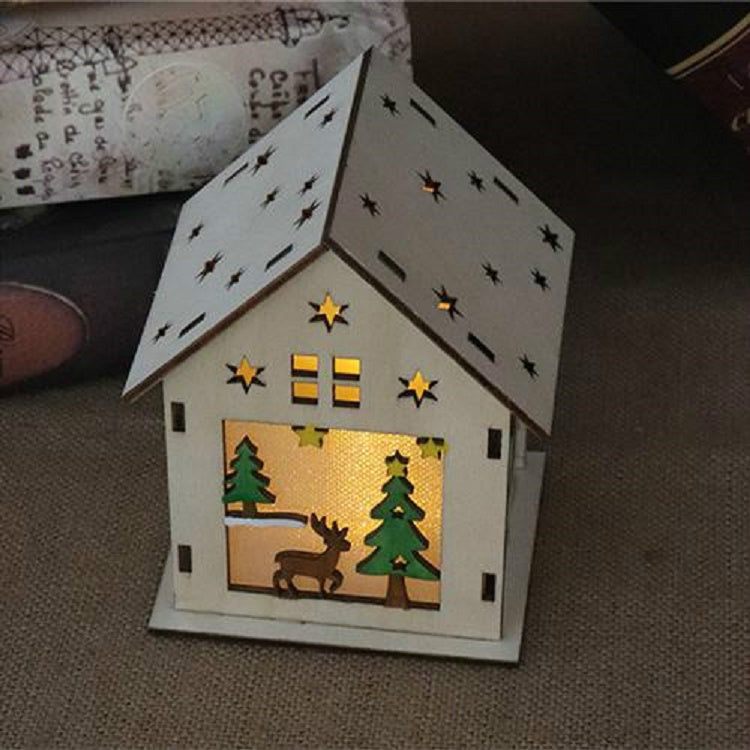 Luminous wooden house ornament with warm yellow-lit deer and pine tree window scene