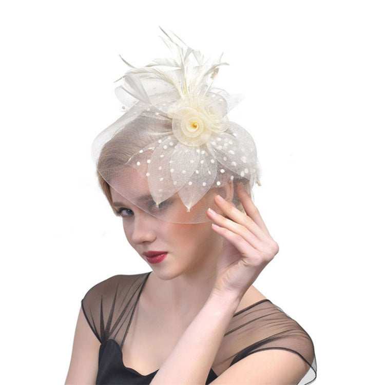 Ivory mesh hair fascinator with swirl rosette flower and dot tulle accents