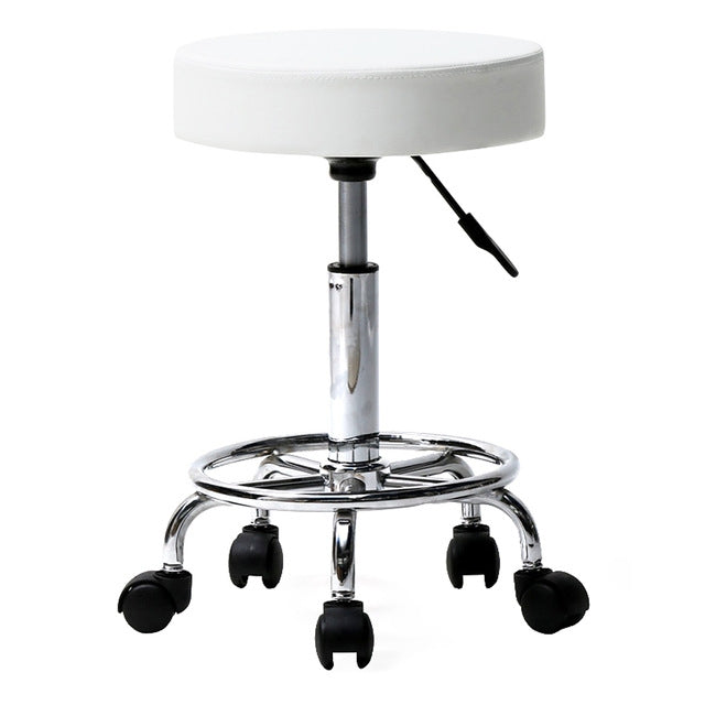 Adjustable barber stool with round white padded seat, chrome pedestal and rolling casters
