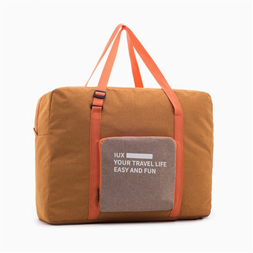 Brown folding travel duffel bag with orange straps and front pocket