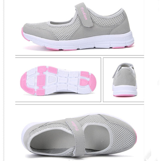 Gray mesh flat sneakers with outsole view, heel profile, and strap detail