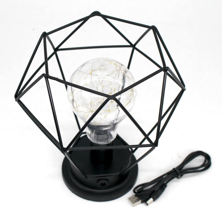 Geometric table lamp with black wrought-iron cage and clear bulb, USB cable included