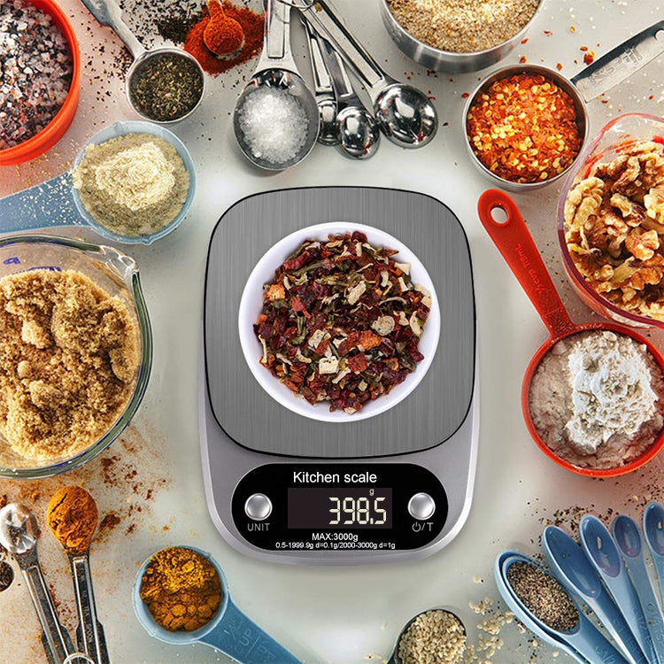 Stainless steel kitchen digital scale with LCD weight reading on kitchen counter
