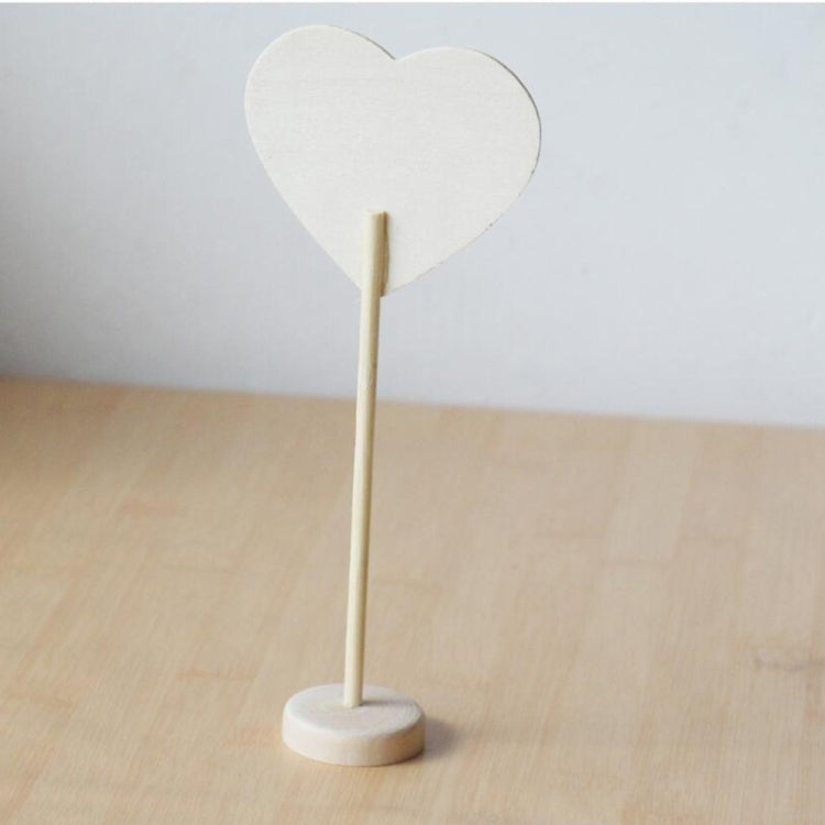 Heart-shaped mini chalkboard on wooden stand, light-colored board