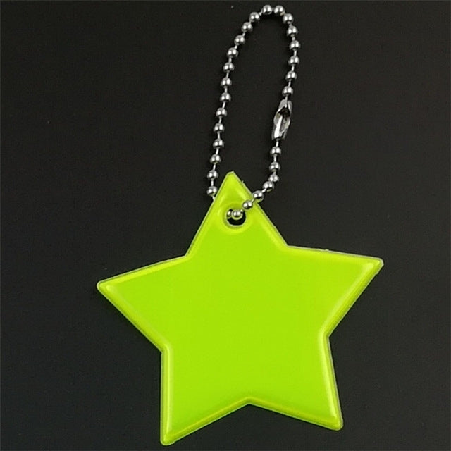 Lime green star keychain pendant with smiling face on a beaded chain loop