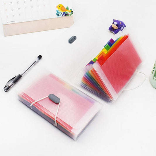 Two A6 multicolor expanding file folders with white lanyard cords and black clips