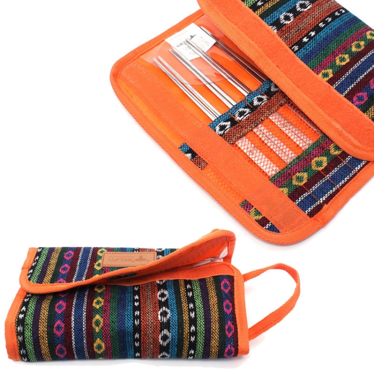 Orange patterned utensil rolls with handles, holding stainless cutlery