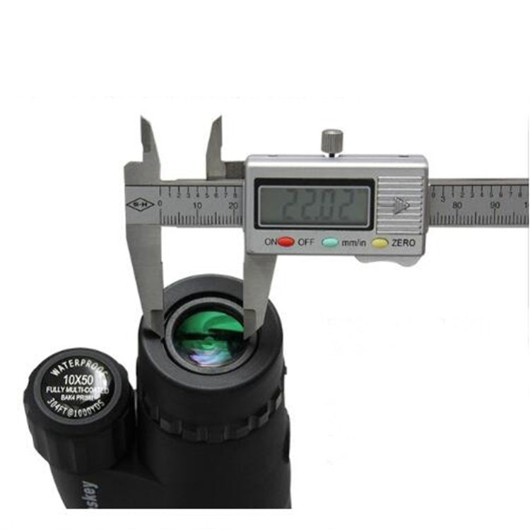 Monocular telescope lens measured with calipers near front lens