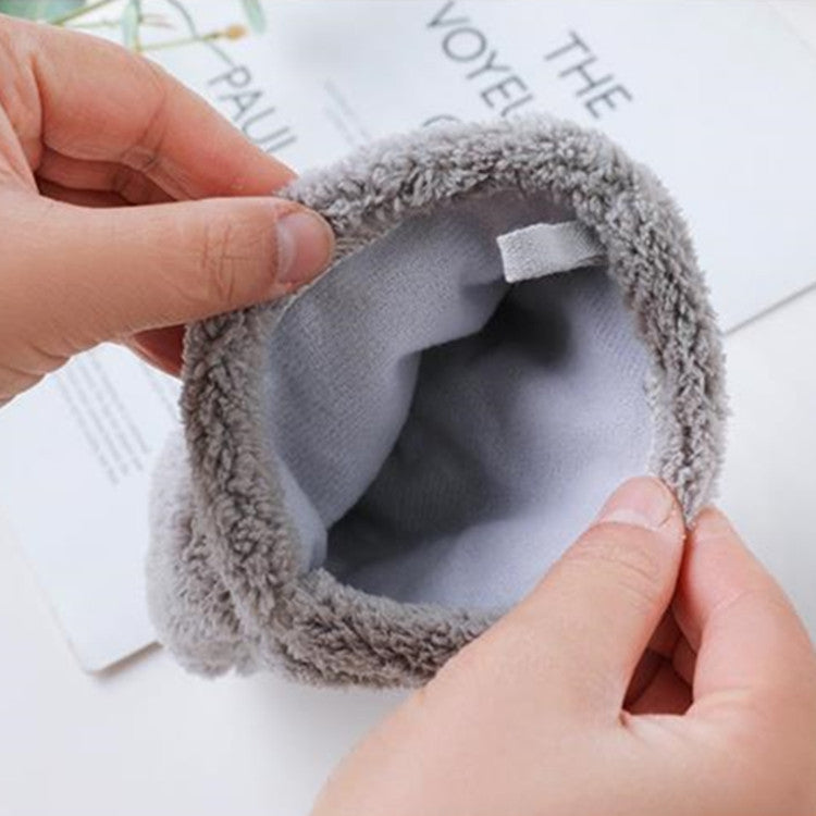 Hands hold open gray hair-drying glove cuff showing soft inner lining.
