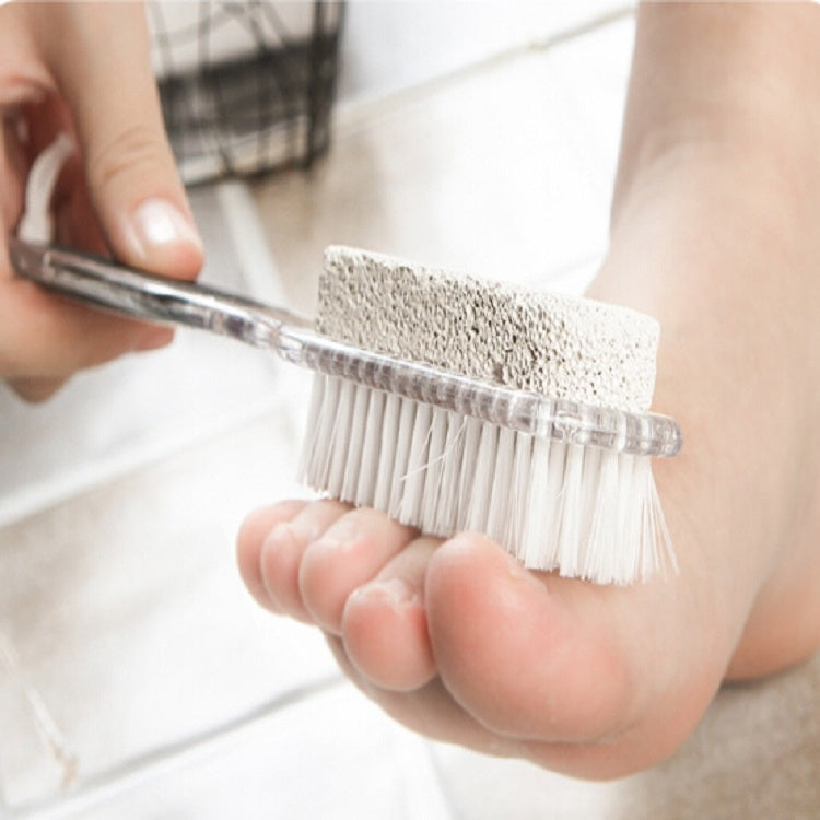 Foot grinding brush in hand with rough stone abrasive pad and white bristles