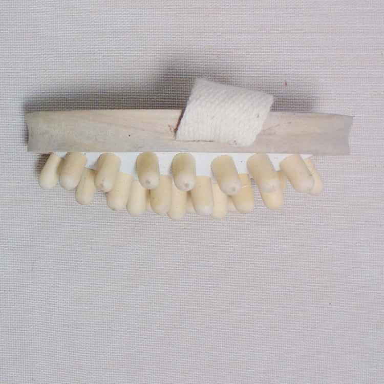 Wood body massager brush with long spiked base and cushioned fabric pad