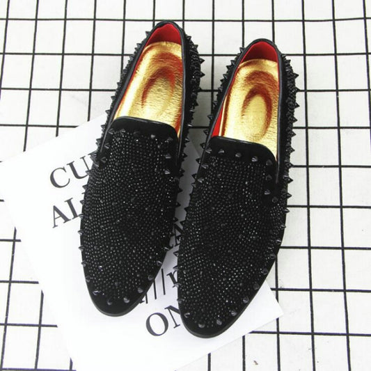 Pair of black pointed-toe rhinestone flats with red-lined interior