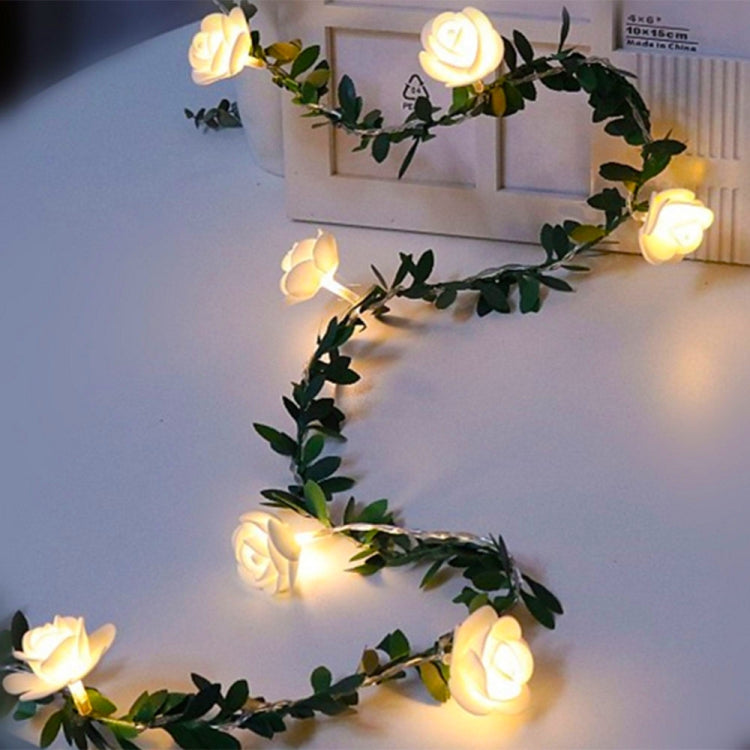 Green leaf vine rose LED light garland with warm glowing rose-shaped bulbs