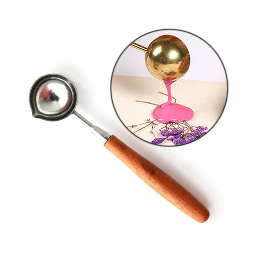 Seal wax melting spoon with round gold bowl and straight wooden handle