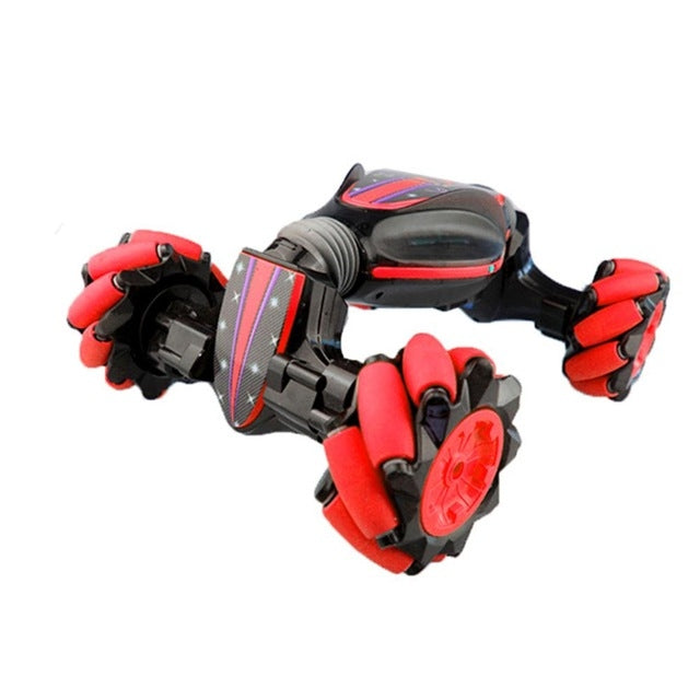 Red gesture-sensing RC stunt car with four omni wheels and glowing LED front panel