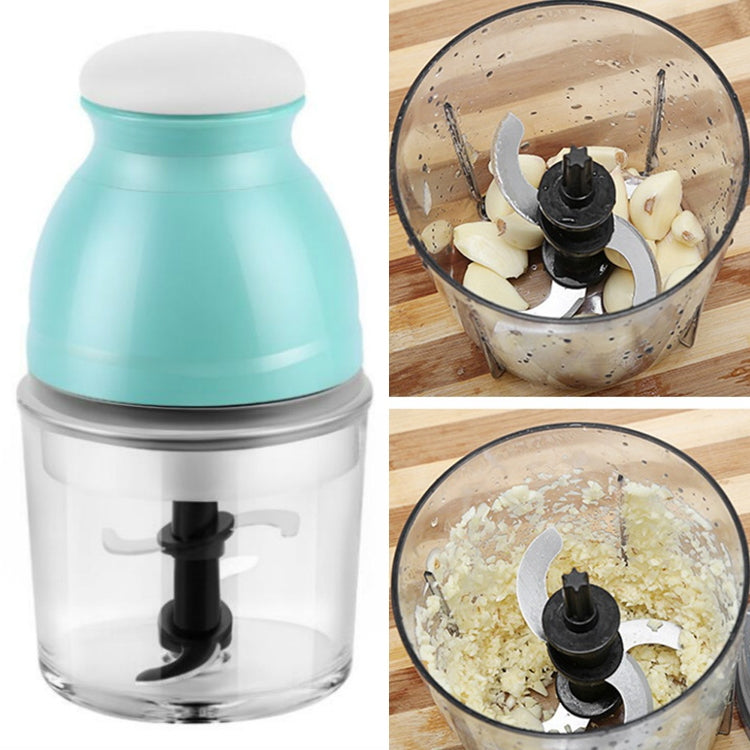 Portable electric soy milk blender with light teal cup and clear jar, visible blending blades