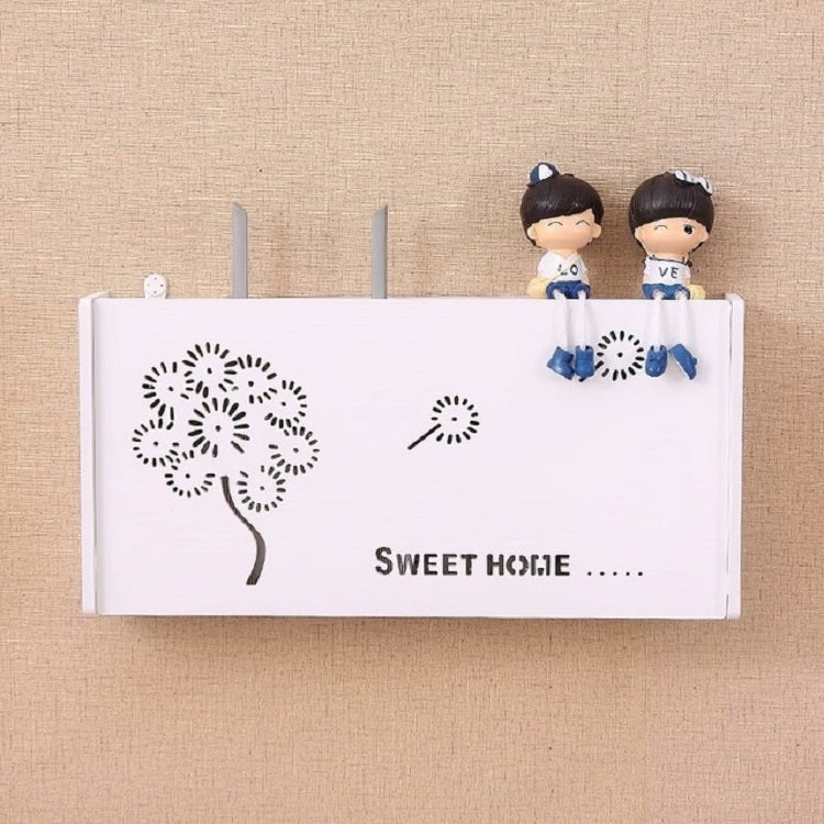 White TV cable storage box with dandelion tree graphic and seated doll figurines