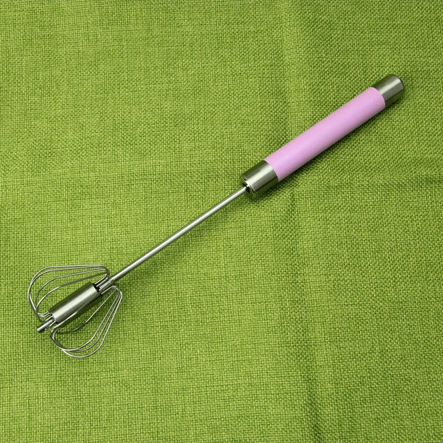 Egg beater whisk with stainless wire beaters and pink handle