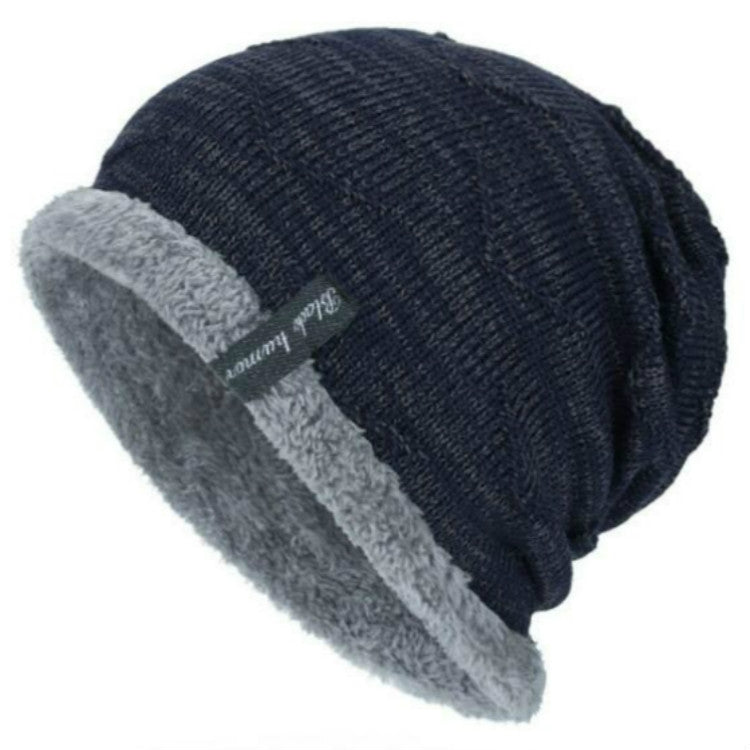Navy knit beanie hat with gray fleece lining and cuff