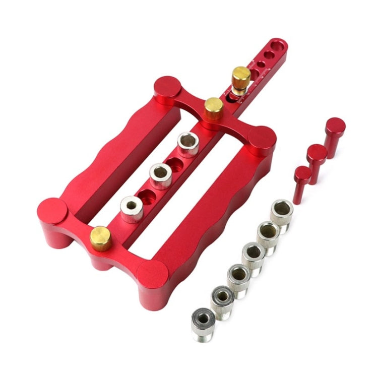 Red vertical triple-hole dowel locating punch with metal guide bushings and pins