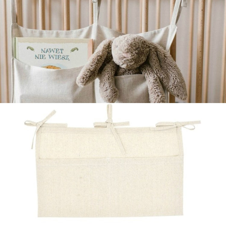 Light linen crib hanging organizer bag with 2 front pockets and ribbon ties