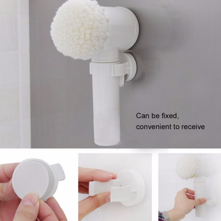 Electric cleaning brush mounted on a wall with white foam and bristle heads