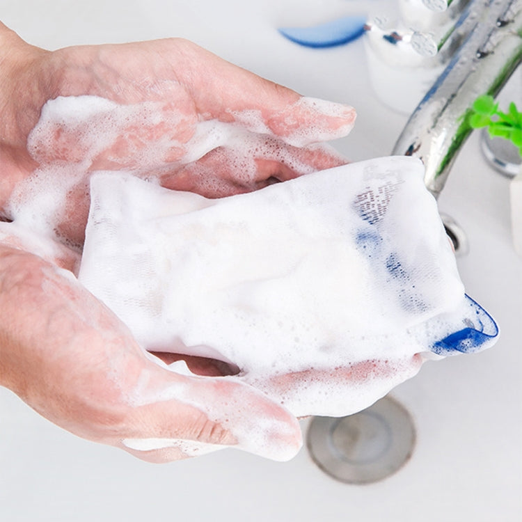 Soapy foam on hands with a white soap bubble net and blue mesh strap