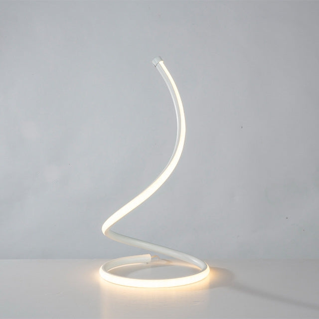 LED spiral table lamp with warm ring glow base and arched light tube, modern bedside