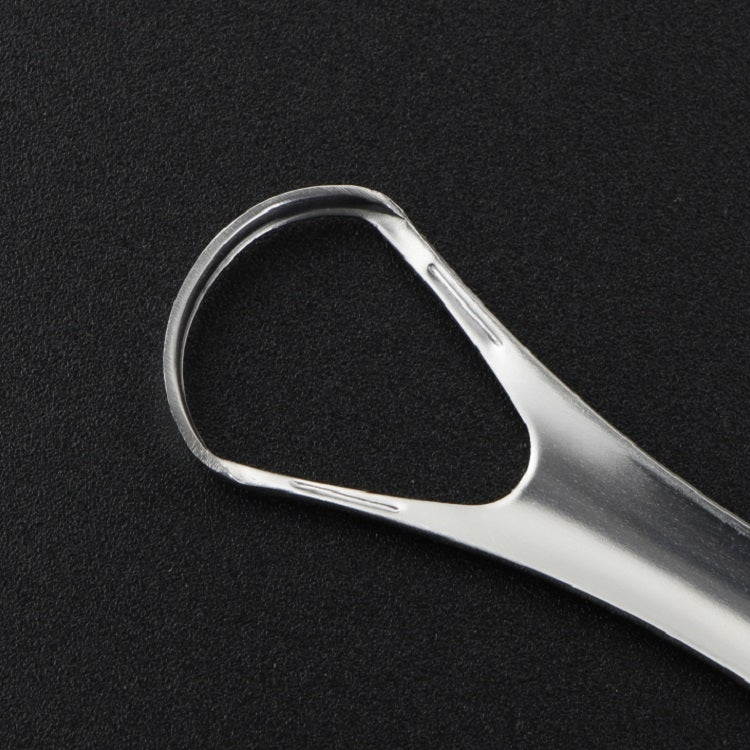 Close-up of stainless steel tongue scraper loop edge for cleaning