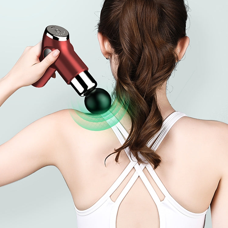 Handheld fascia massage gun using round head on a person’s upper back and neck