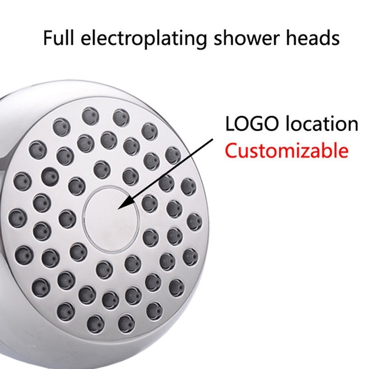 Close-up of round chrome rain shower head face with multiple spray nozzle ports