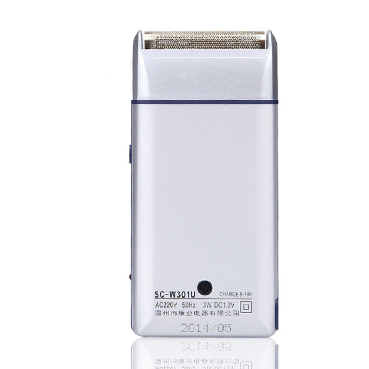 White electric shaver back panel with technical markings and charging indicator