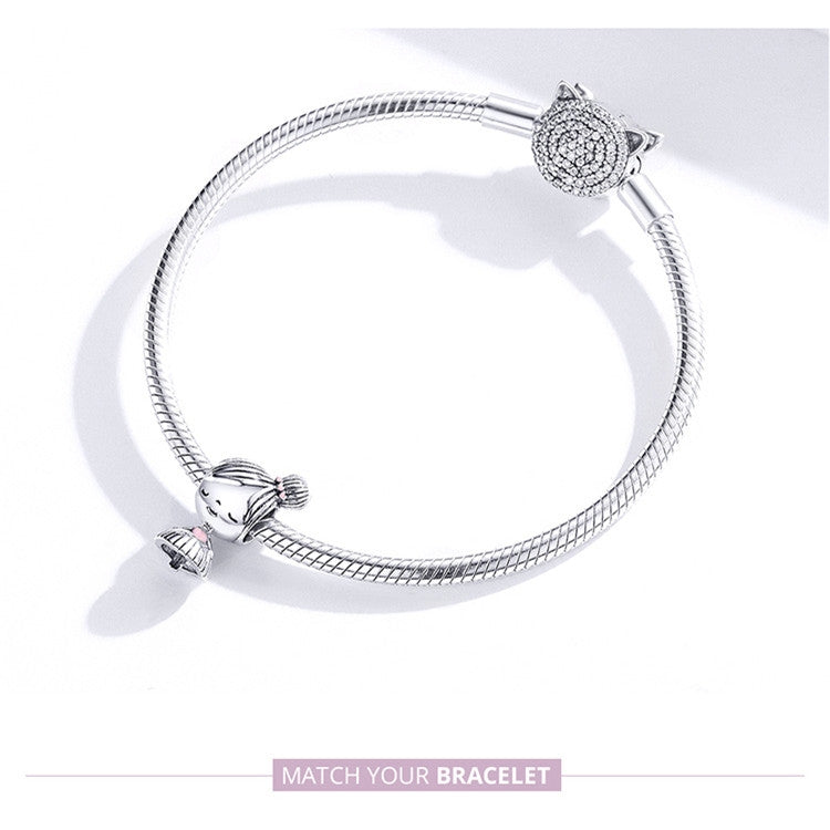 Silver snake chain bracelet with charm bead ends and small heart-like charm