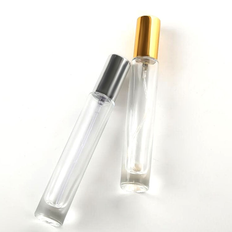 Transparent 10ml perfume spray glass bottles, angled view, gold and silver caps