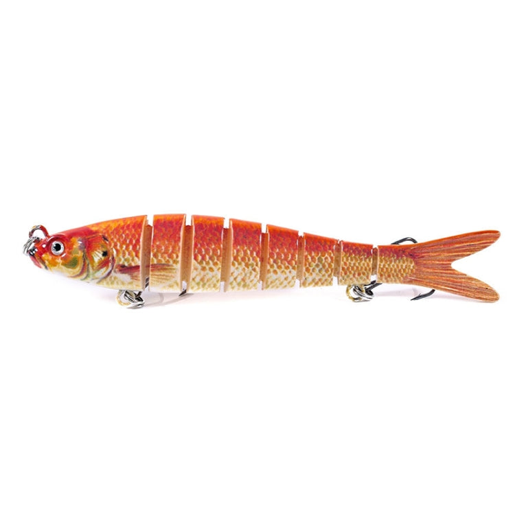 Orange and gold fish-shaped fishing lure with segmented body and treble hook