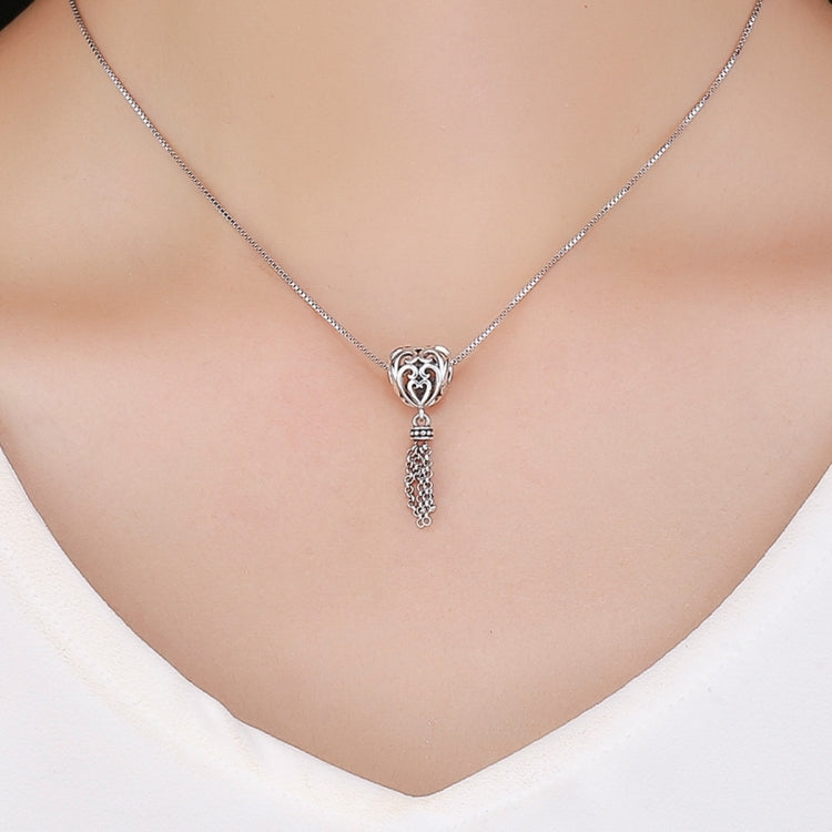 Heart-shaped silver charm bead pendant on a fine chain with dangling tassel