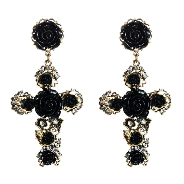 Pair of black rose cross long dangle earrings with gold-tone accents and rhinestones